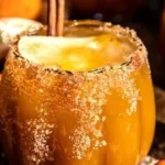 Haunted Pumpkin Patch Margarita cocktail with pumpkins in the background