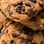 Delicious healthy pumpkin chocolate chip cookies on a rustic wooden table.