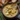 Delicious bowl of hearty cheddar garlic herb potato soup topped with herbs
