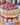 Heavenly White Chocolate Raspberry Cake adorned with fresh raspberries and white chocolate curls