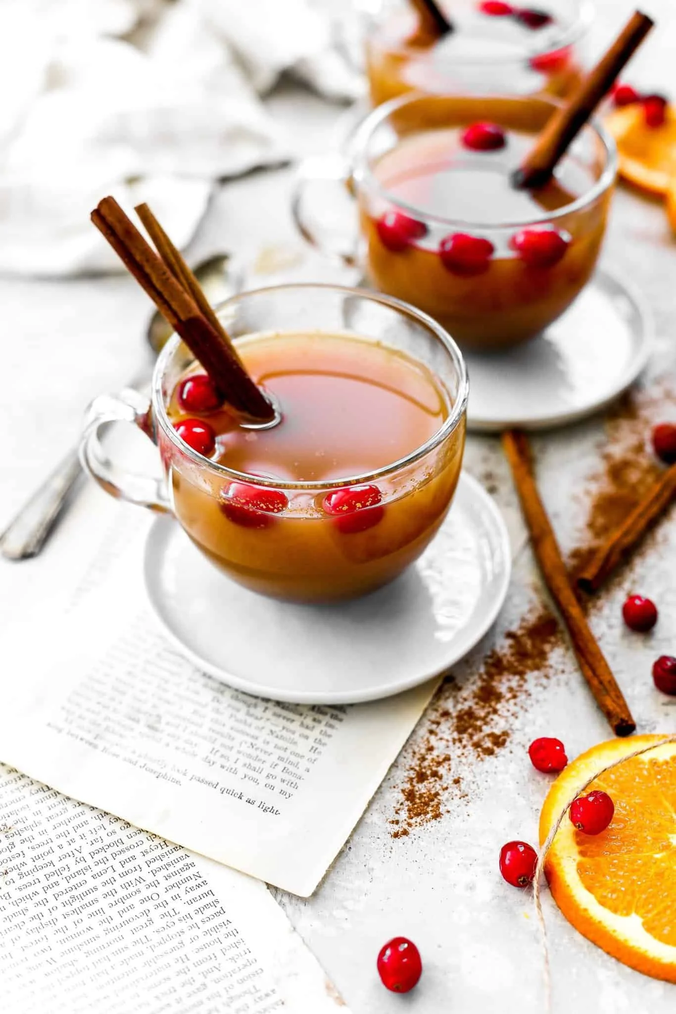 Freshly made homemade apple cider with sliced apples and spices