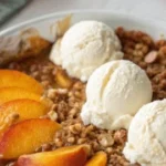 Homemade peach crisp dessert with juicy peaches and crispy topping