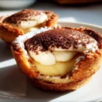 Delicious tiramisu cookie cups topped with cocoa and coffee flavor