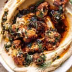 Bowl of Mediterranean Crispy Roasted Cauliflower Hummus with pita and veggies