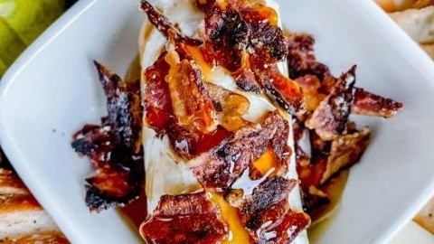 Delicious Million Dollar Bacon Goat Cheese Appetizer Log served with crackers