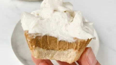 Mini pumpkin pie cups served on a platter for fall dessert.