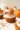 Mini vegan pumpkin pies served on a rustic wooden table