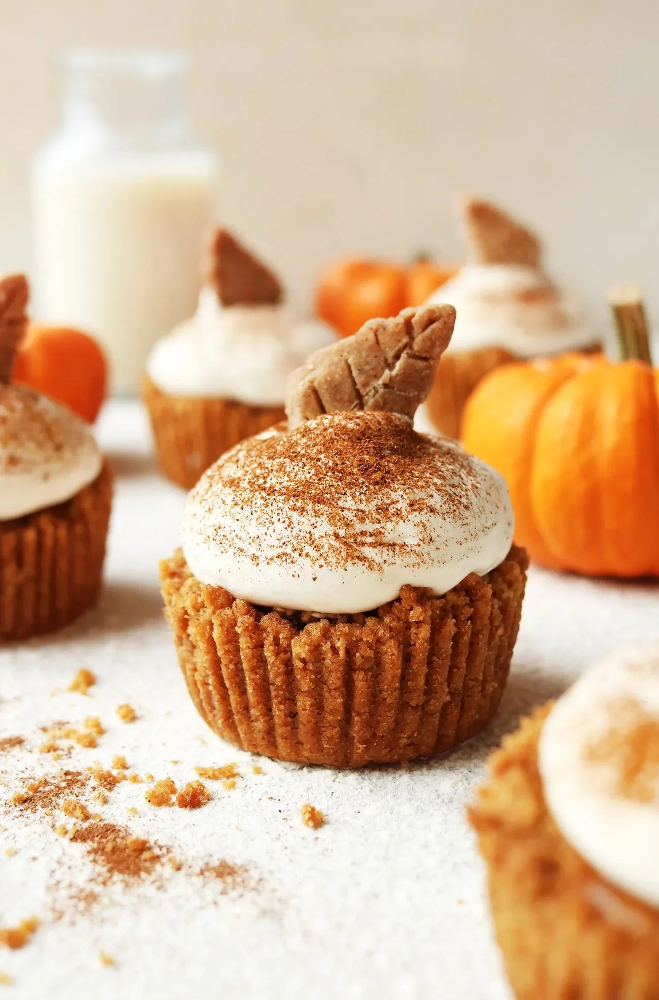 Mini vegan pumpkin pies served on a rustic wooden table