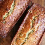 Delicious slice of Mrs. Myers' banana bread on a wooden table