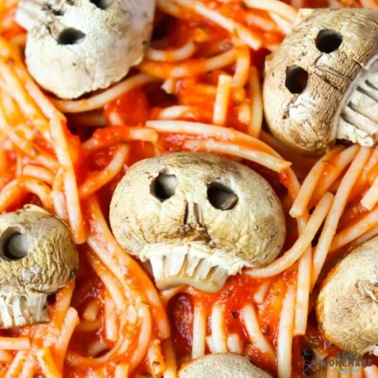 Plate of Mushroom Skull Spaghetti with decorative skulls and herbs