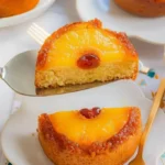 Pineapple and cherry upside-down mini cakes displayed on a dessert platter