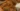 Slice of Pioneer Woman pumpkin chocolate chip bread on a wooden table