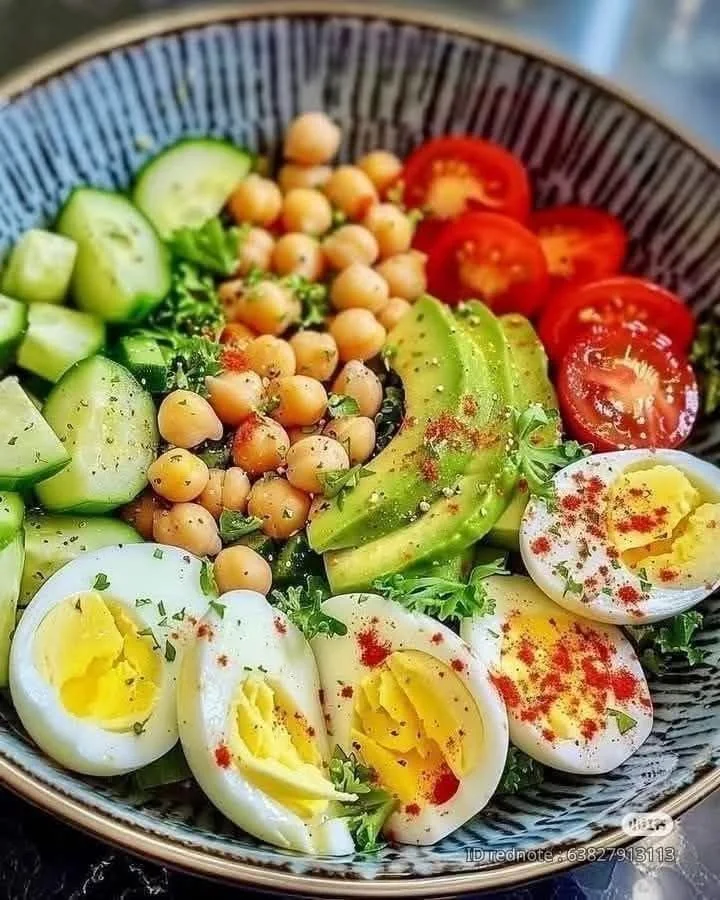 Protein-packed chicken egg salad in a bowl with fresh vegetables