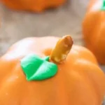 Delicious Pumpkin Oreo Balls coated in chocolate, perfect for fall treats.
