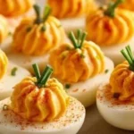 Pumpkin Patch Deviled Eggs served on a decorative plate