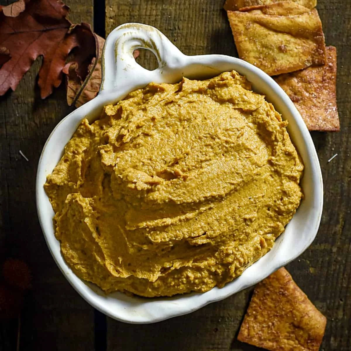 Delicious pumpkin pie hummus served with cinnamon and graham cracker sticks
