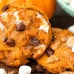 Delicious Pumpkin S'mores Cookies with chocolate and marshmallow topping.