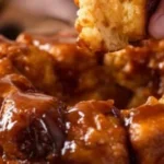 Delicious Pumpkin Spice Monkey Bread topped with caramel glaze and spices