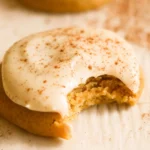 Pumpkin spice sugar cookies decorated with cream cheese frosting