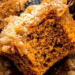Delicious pumpkin streusel muffins freshly baked with spices and a crumbly topping.