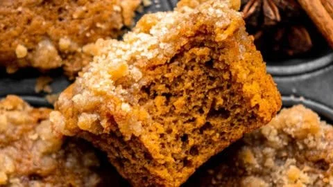 Delicious pumpkin streusel muffins freshly baked with spices and a crumbly topping.