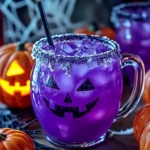 Purple Halloween Punch served in a spooky Halloween-themed glass.