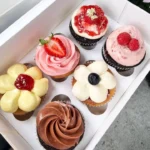 Delicious cupcakes with colorful frosting and sprinkles