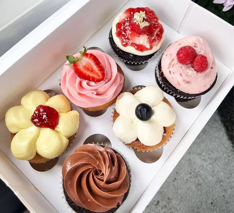 Delicious cupcakes with colorful frosting and sprinkles