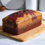 Delicious Red Velvet Marble Loaf Cake with swirls of cream cheese frosting
