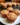 Rhubarb muffins with cinnamon and brown sugar on a rustic wooden table