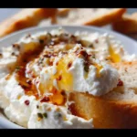 Creamy seasoned whipped ricotta topped with honey for a delicious treat