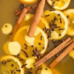 Delicious slow cooker mulled cider with spices and apples in a cozy setting