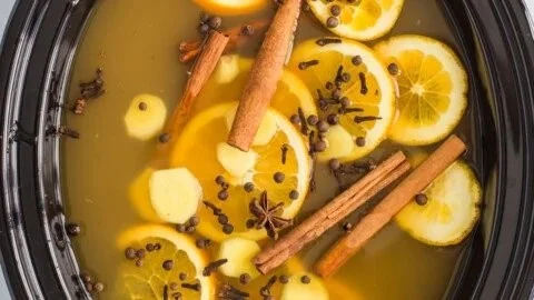 Delicious slow cooker mulled cider with spices and apples in a cozy setting
