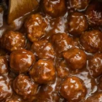 Delicious Slow Cooker Salisbury Steak Meatballs served with gravy and mashed potatoes.