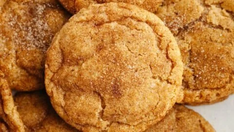 Delicious soft and chewy pumpkin cookies on a rustic wooden table