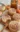 Soft pumpkin cookies drizzled with cinnamon frosting on a plate