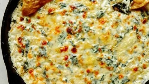 Creamy Spinach Artichoke Dip served with crispy tortilla chips