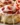 Strawberry Cheesecake Cinnabon Rolls topped with fresh strawberries and cream cheese icing