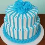 Stylish blue striped cake decorated with elegant roses for special occasions