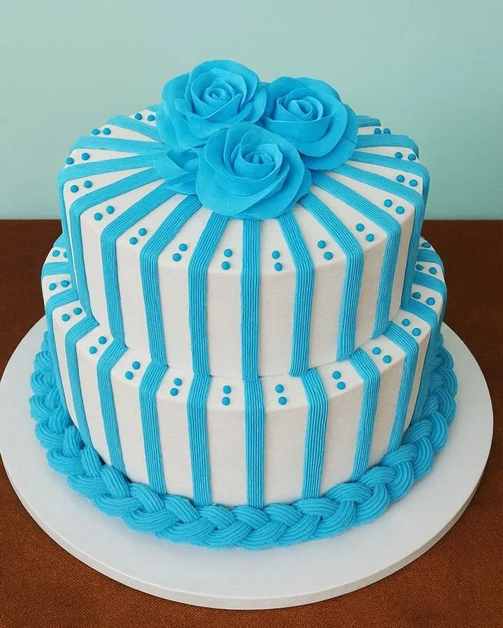Stylish blue striped cake decorated with elegant roses for special occasions