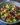 Sun-dried Tomato and Feta Salad with Black Olives garnished.
