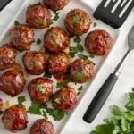 Sweet chili meatballs in a crockpot, ready to be served.