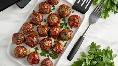 Sweet chili meatballs in a crockpot, ready to be served.