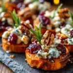 Sweet potato rounds topped with blue cheese, cranberries, and pecans