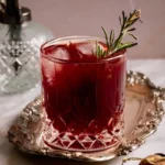 Vampire's Kiss Non-Alcoholic Cocktail Recipe with ingredients and garnishes