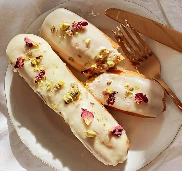 Delicious Vanilla Éclairs filled with creamy custard and topped with chocolate