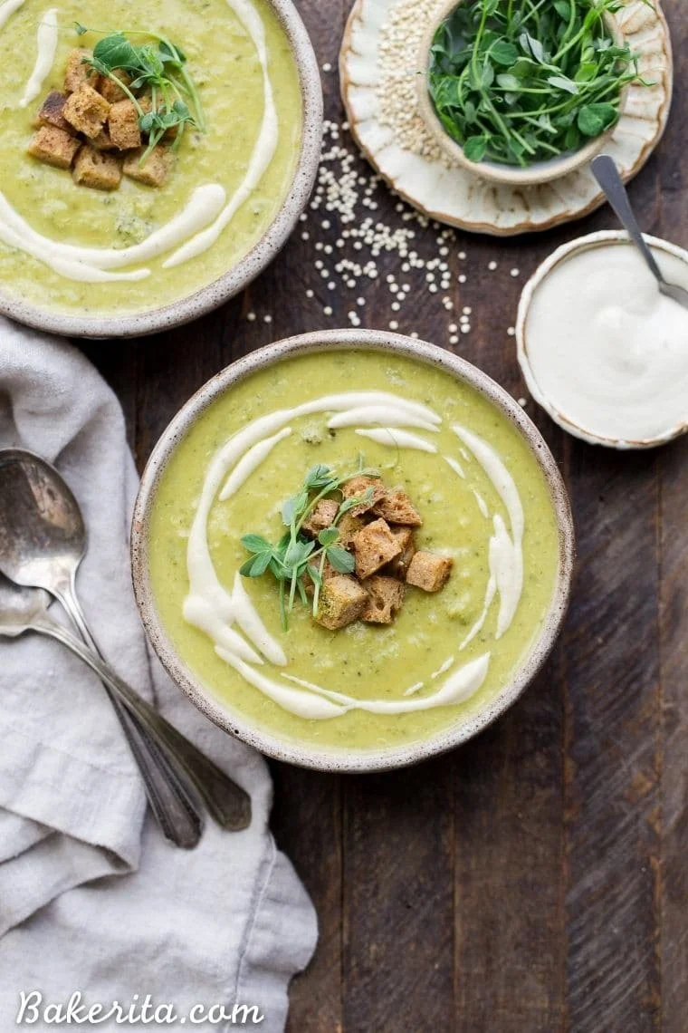 Bowl of vegan broccoli quinoa soup with fresh ingredients and herbs