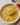 Delicious vegan potato soup garnished with fresh herbs in a bowl