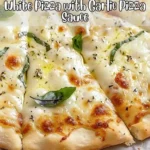 Delicious white pizza topped with rich garlic pizza sauce and fresh ingredients.