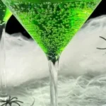 Bowl of colorful Witches Brew Punch with spooky decorations